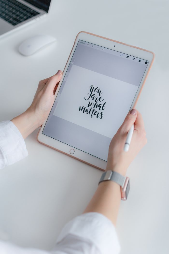 journey Elegant workspace showing tablet with motivational quote in modern setting.